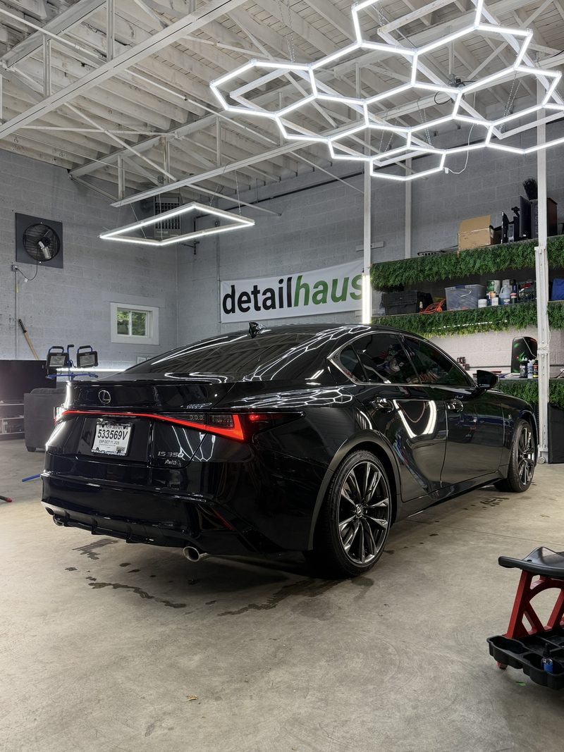 Black Lexus IS rear under the hex lighting at DetailHaus